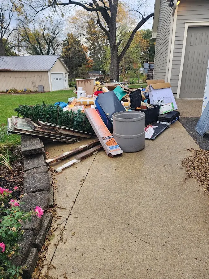 Dumpster being loaded with debris for 30 Yard Dumpster Rental in Mount Prospect